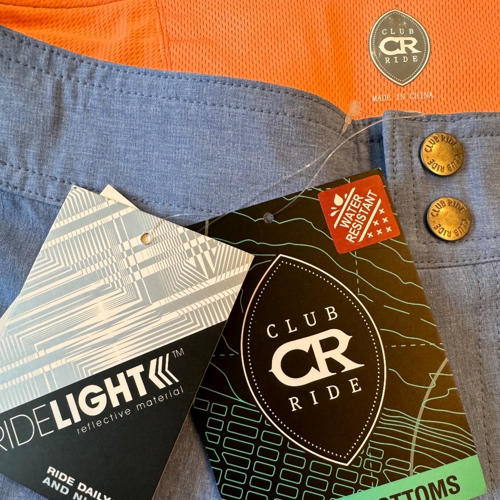 Club Ride Apparel Women’s Shorts in Blue with Orange Liner